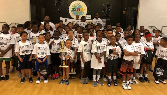 Children and volunteers gathered at a Dion Waiters youth event