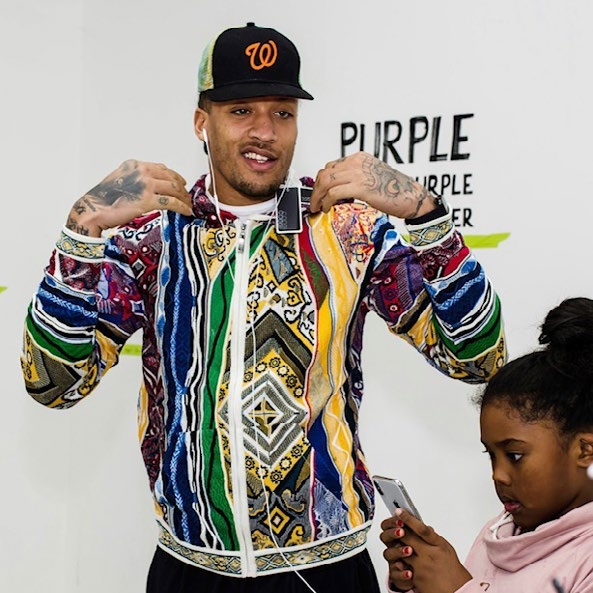 Mike Beasley wearing a colorful jacket at a brand experience