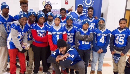 Mike Mitchell pictured with a youth football team